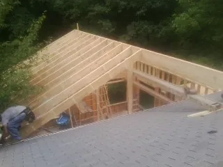 Framing a new roof addition that ties into an existing shingle roof in College Springs